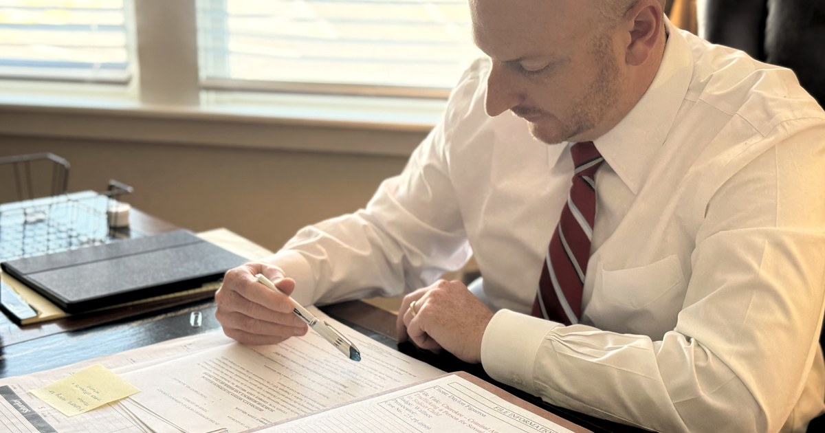 Attorney reviewing case documents
